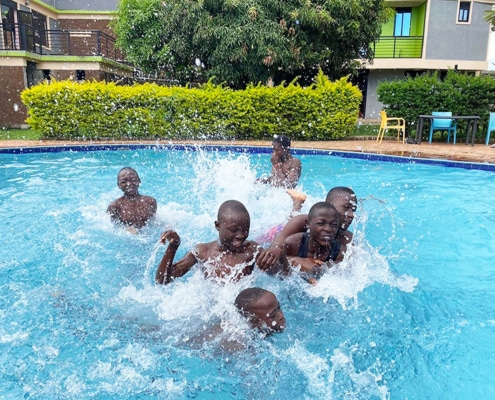 Boys playing in the pool