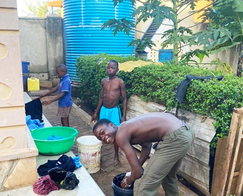 Former street children washing their clothes