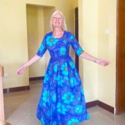 Jane in a new dress, handmade by a former street child in Uganda