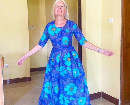 Jane in a new dress, handmade by a former street child in Uganda