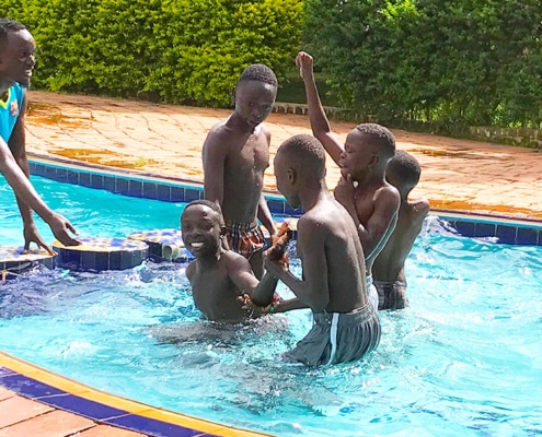 Five former street children swimming
