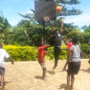 Boys playing basketball at Homes of Promise