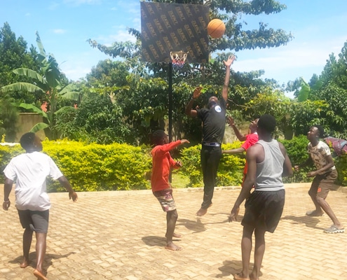 Boys playing basketball at Homes of Promise