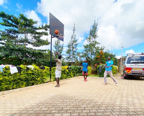 Boys playing basketball at the charity