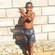 One of the charity boys wearing new home-made shorts