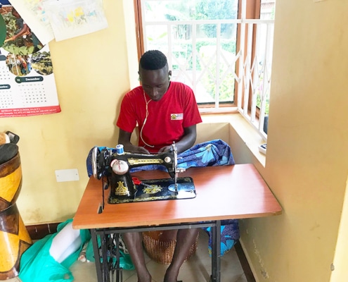 A former street child now making clothes