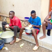 Former street boys helping to prepare a barbeque