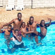 Boys and staff from the charity in the pool