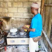 One of the former street boys cooking for everyone
