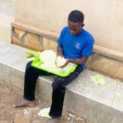 One of the boys preparing a meal