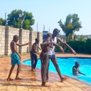 Boys from the charity at the pool