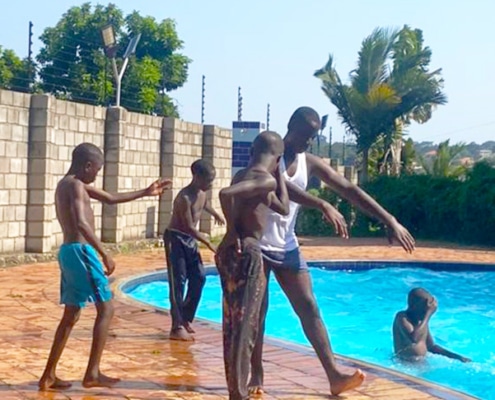 Boys from the charity at the pool