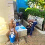 Former street boys washing their clothes