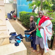 Two former street children washing their clothes