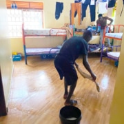Boys cleaning their room at George's Place
