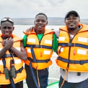 Two of the boys at George's Place on a boat trip with a charity worker