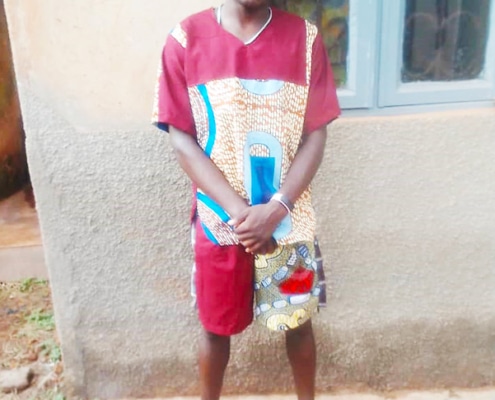 A former street boy now making clothes