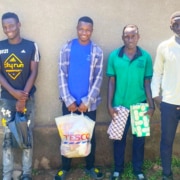 Four boys from the charity in college