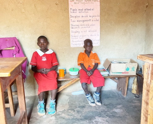 Two children at school in Kayunga, Uganda