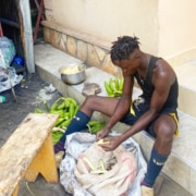Former homeless boy helping to make lunch
