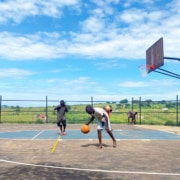 Boys playing basketball at the Academy
