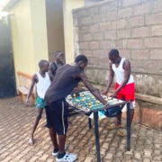 Boys at George's Place enjoying the donated table football