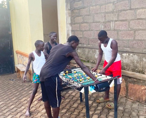 Boys at George's Place enjoying the donated table football