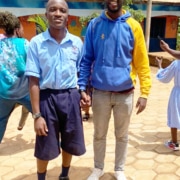 One of the charity workers visiting a boy at college