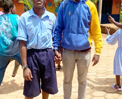 One of the charity workers visiting a boy at college