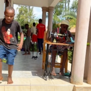 Two former street children making clothes