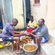 Three boys at the charity preparing dinner