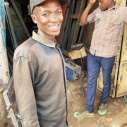 One of the boys from Homes of Promise starting work at a welding business