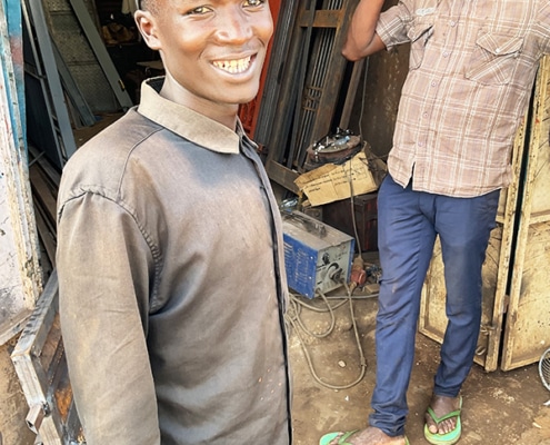 One of the boys from Homes of Promise starting work at a welding business