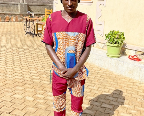A boy at the charity now makes his own clothes