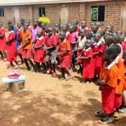 Delivering donated items to a school in Kayunga