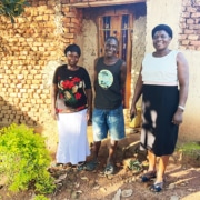 A former boy from the charity with his family in Bugiri