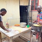 Former street boys cooking breakfast