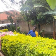 Former street child working on the garden