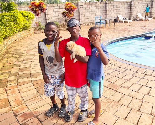Former children from the streets of Kampala now at the pool together