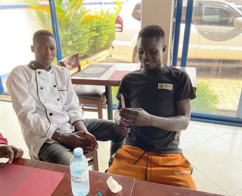 Former homeless boy now working in a restaurant in Iganga