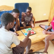 Four former street children playing together