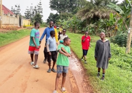 Former homeless boys going swimming with one of the charity workers