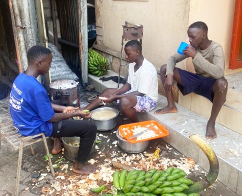 Boys at the charity preparing food