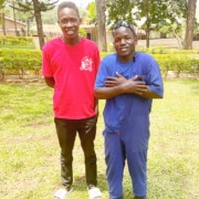 Two boys from the streets of Kampala now at Don Bosco college