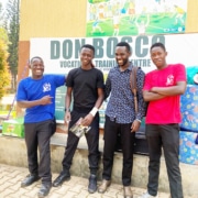 Three former street boys from Kampala now at college