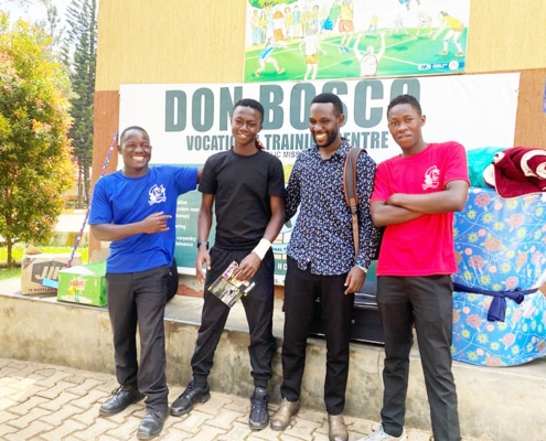 Three former street boys from Kampala now at college