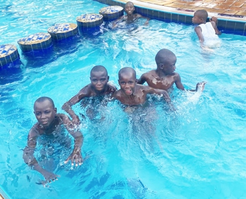 Former homeless boys at the pool