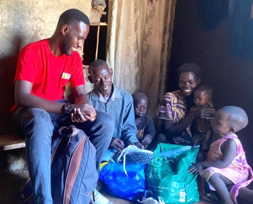 Charity worker visiting one of the boy's family