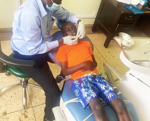A boy from the charity at the dentists