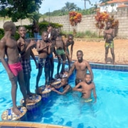 Former homeless boys swimming together